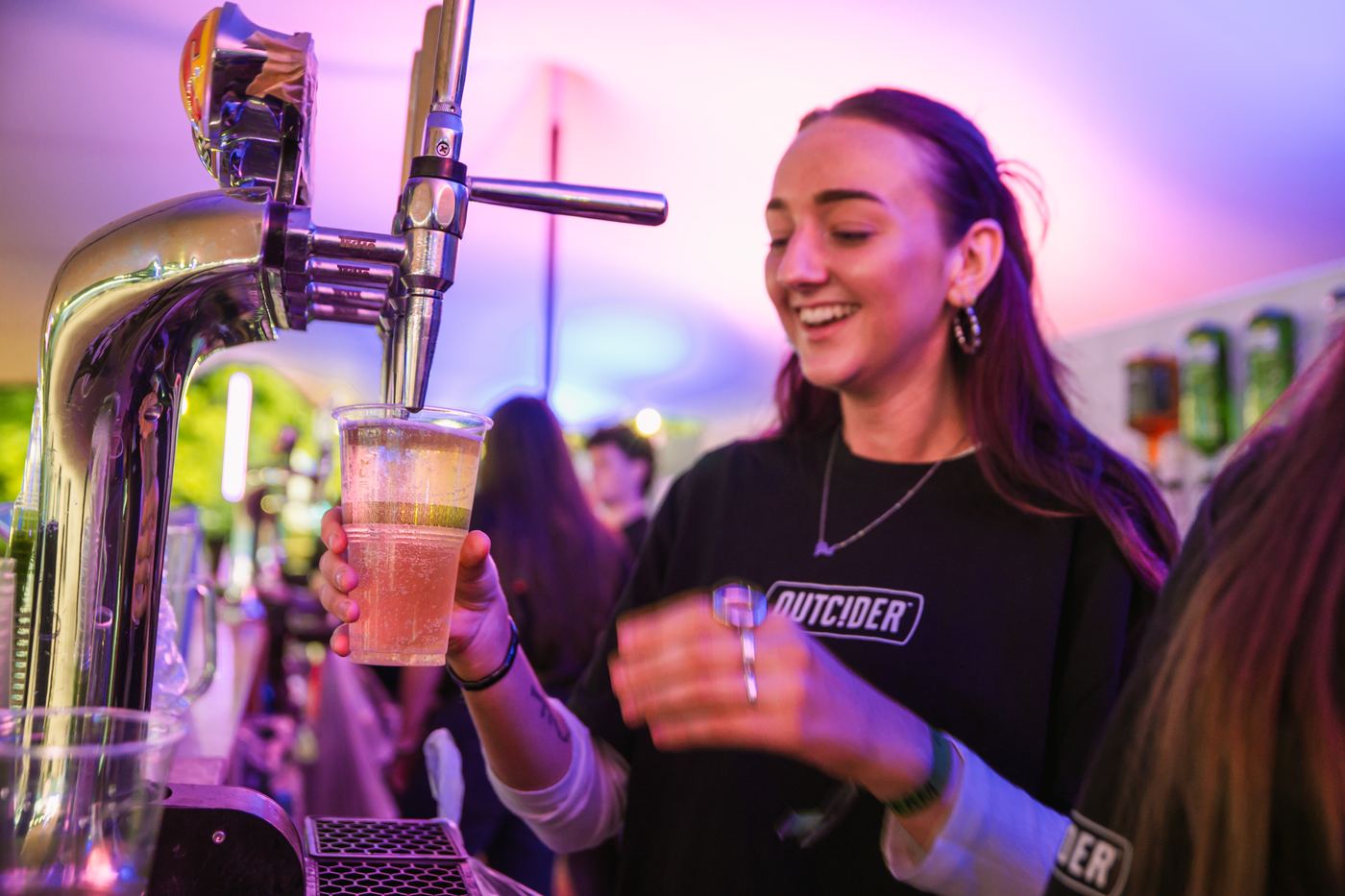 Apex bar staff serving at a branded bar